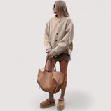 Mila™ | Laukku sivurypytyksellä